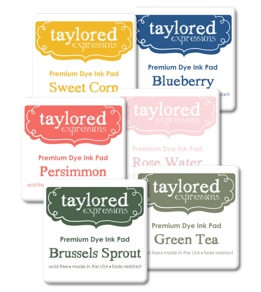 Six Taylored Expressions premium dye ink pads in colors Sweet Corn, Blueberry, Persimmon, Rose Water, Brussels Sprout, and Green Tea.