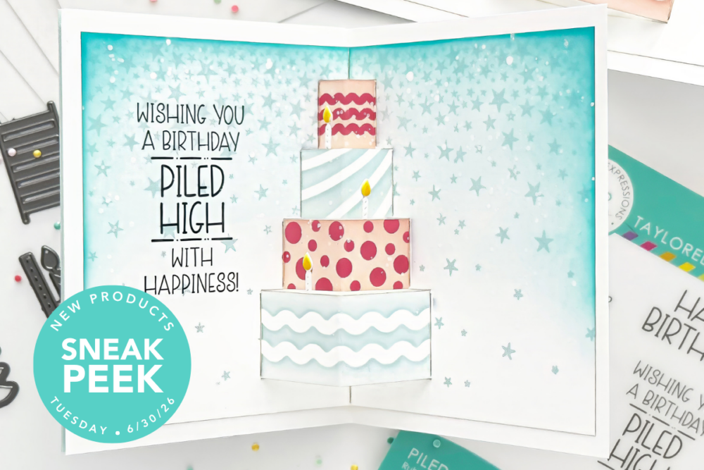 Pop-up birthday card showing a four-tier cake with candles on a teal starry background and the message 'Wishing you a birthday piled high with happiness', plus a teal 'Sneak Peek' badge in the corner.
