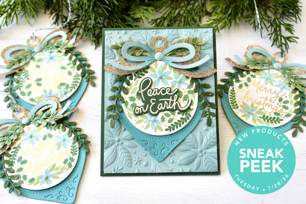 Decorative Christmas card with teal and green wreath, gold glitter bow, and 'Peace on Earth' text