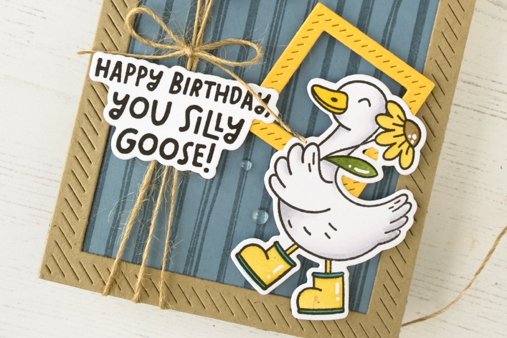 Handmade birthday card featuring a cartoon goose in yellow boots holding a flower with the message 'Happy Birthday to You, Silly Goose!'