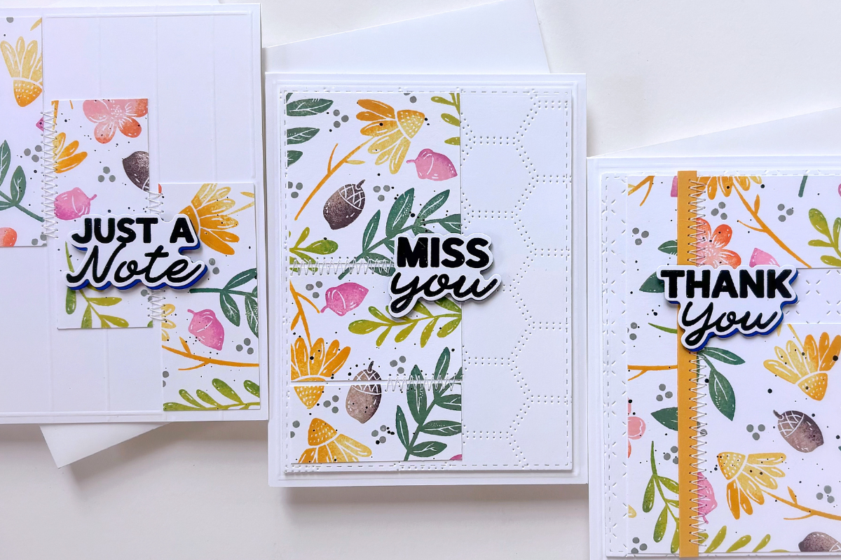 Set of three white greeting cards with colorful floral panels and bold black-and-white sentiments: 'Just a Note', 'Miss You', and 'Thank You'.