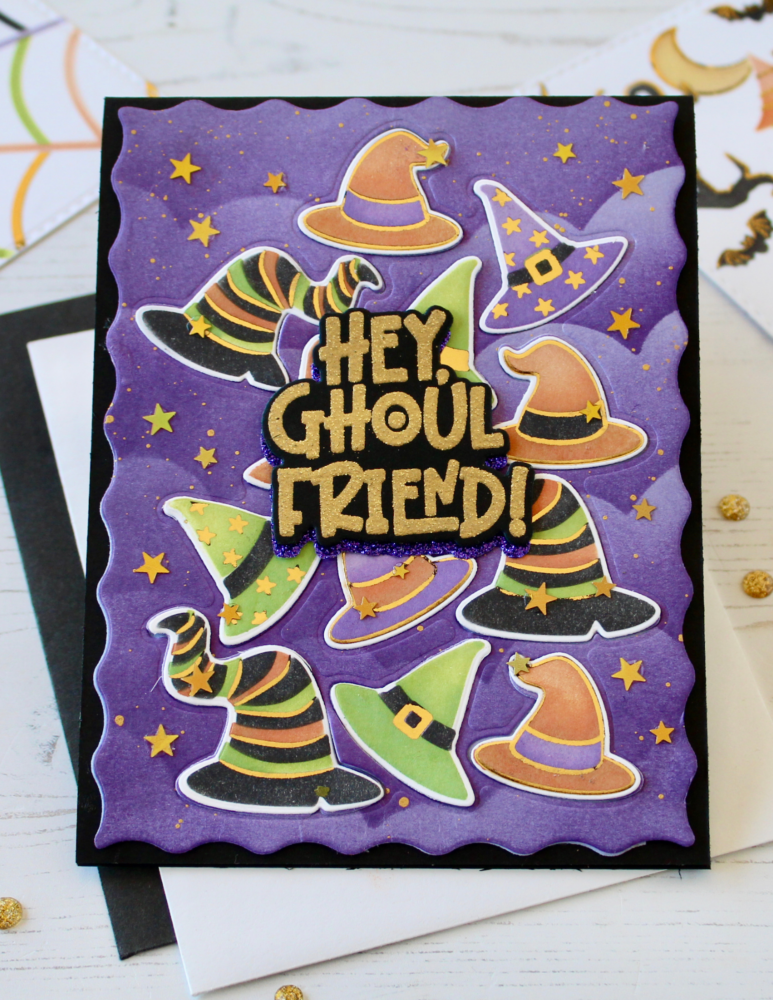 Purple Halloween card with witch hats, stars, and the greeting 'Hey Ghoul Friend!' on a black base.